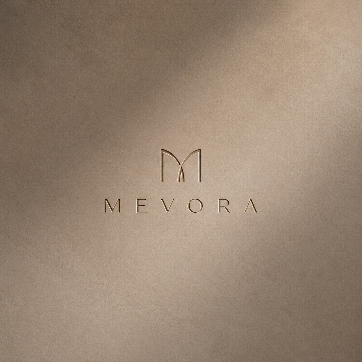 The Mevora wordmark engraved in bronze